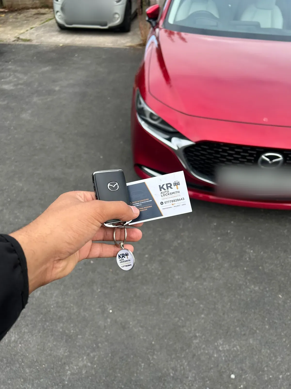 A replacement key fob for a Mazda 3, programmed on the drive