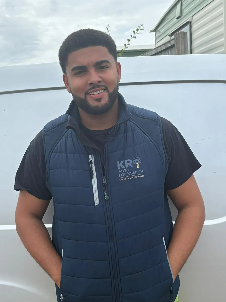 KR Auto Locksmith standing in front of his van in a branded KR gilet
